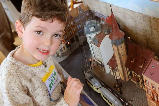 Maximus Goodwin, seven, with his dad's layout. D14201412a