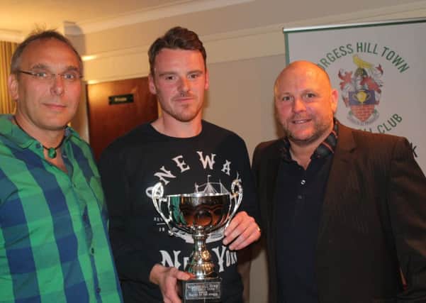 Joe Keehan collects the First Team Player of the Year from Ian Chapman and Mark Parsons from sponsors Green Elephants