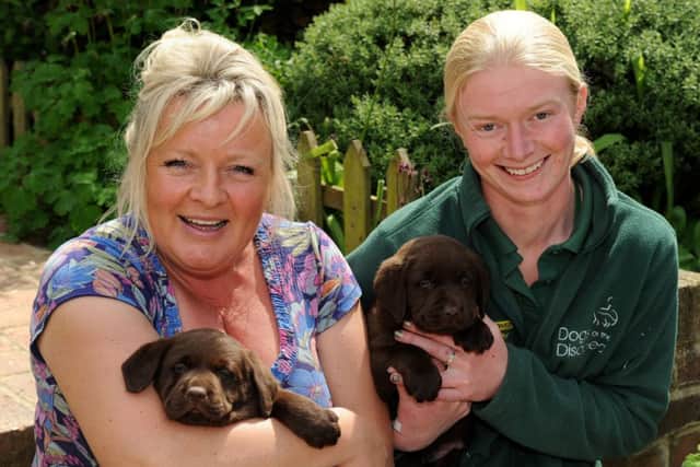 Owner of Wolstonbury Kennels Michelle Steer and Becci Hodge from Dogs for the Disabled. Pic Steve Robards SUS-140517-163745001