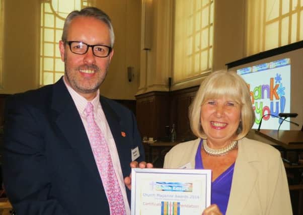 Editor Pamela Chaston receiving her award for Henfield Parish Magazine award from Major Stephen Poxon at Westminster Central Hall on Saturday. Pic by Barry Chaston SUS-140520-145820001
