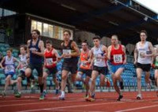 Adrian Haines (in black) breaks his own British M45 record for a mile race at the British milers club meeting
