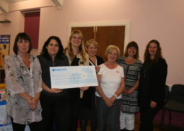 Goring Slimming World members  with a cheque for Chestnut Tree House