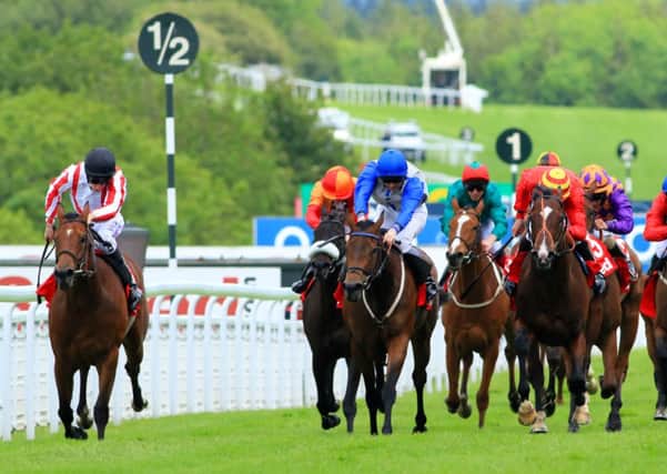 Wee Jean ridden by Luke Morris (left) on his way to victory in the 32 Red.com Stakes on the last day of the festival Picture by Chris Hatton