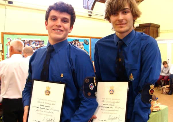 Alex Ward and Callum Dean receive their Queen's Awards at the 25th anniversary event of the 3rd Burgess Hill Boys Brigade. SUS-140529-095015001