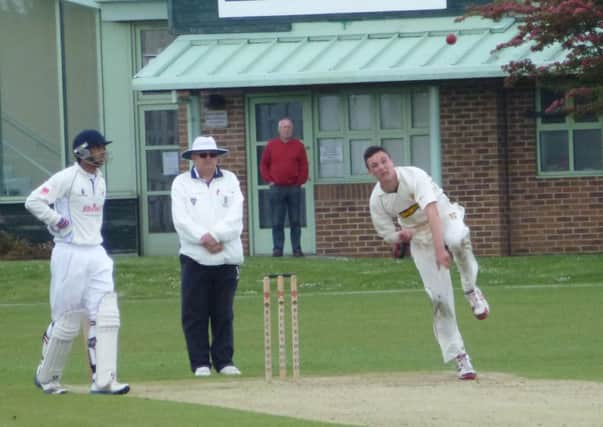Elliot Hooper, pictured here bowling against Roffey last weekend, scored a half-century with the bat and took four wickets with the ball in Hastings Priory's draw away to Preston Nomads yesterday