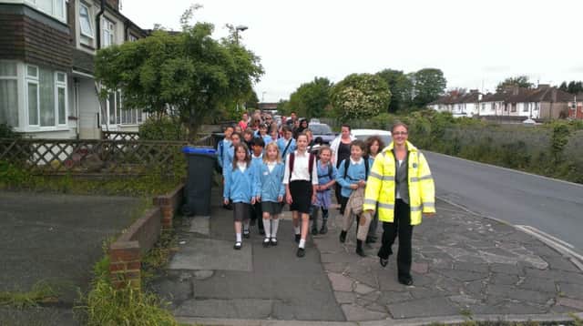 Seaside Primary School pupils walk to school as deputy head Nicola Irwin leads the march