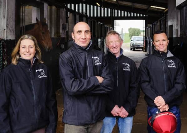 Luke Dace (second from left, with his wife Louise and two members of staff) is inviting racehorse owners to attend his open morning SUS-140206-122129001