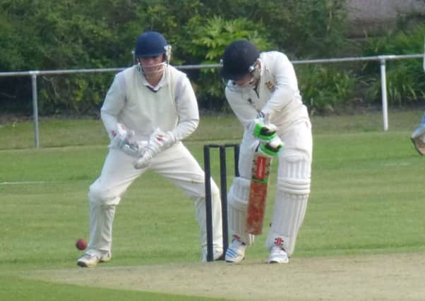 Leo Cammish plays a defensive push into the off-side en route to an unbeaten half-century for Hastings Priory against Bexhill yesterday. Picture by Simon Newstead (SUS-140206-094256002)