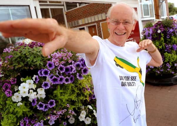 Bill Kent of reMEmber wearing the t-shirt signed and donated by Usain Bolt. Pic Steve Robards SUS-140306-081136001