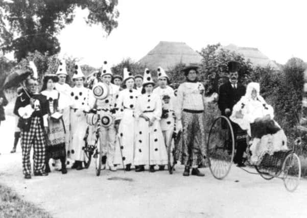 East Preston carnival parade, 1910. The pierrot on the right is Walter Booker, son of the village blacksmith