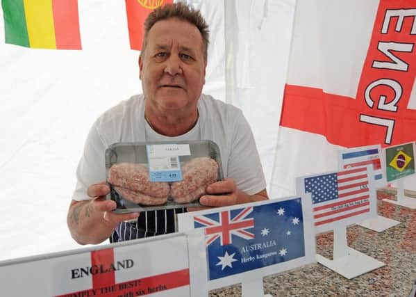 Butcher Gary Knight with some of his World Cup inspired sausages, which will be on sale from June 7