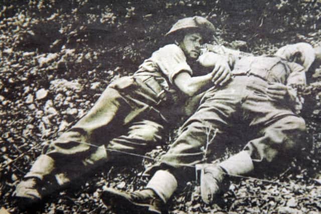 JPCT 310514 S14230447x Horsham. Kazimierz Domanski, a Polish war veteran, went to the war commemoration in Monte Casino recently and met Prince Harry. Old photo shows him laying wounded in the battle at Monte Casino  -photo by Steve Cobb SUS-140306-110331001