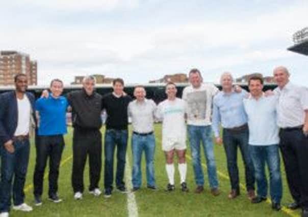 Sporting legends with Bretts Bullets, the winning team of the 2014 football competition hosted at Upton Park - picture by Davin Dhillon