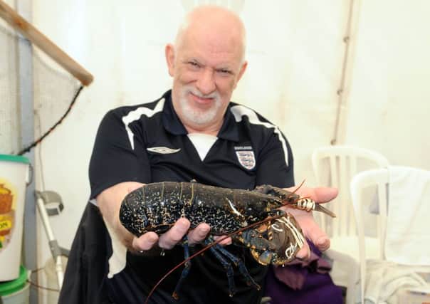 S24403H13 Len Nevell with a shellfish at last year's Adur World Oceans Day