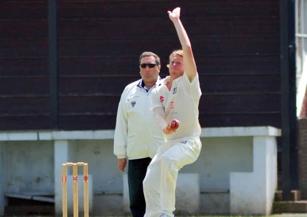 Dean Crawford bowling for Bexhill against Brighton & Hove. Picture by Steve Hunnisett (SUS-140706-181305002)