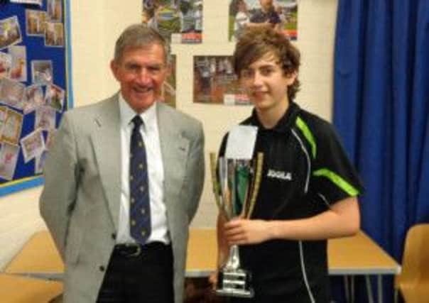 Jack Bennett is presented with the Invitation Cup by Bob Mansell