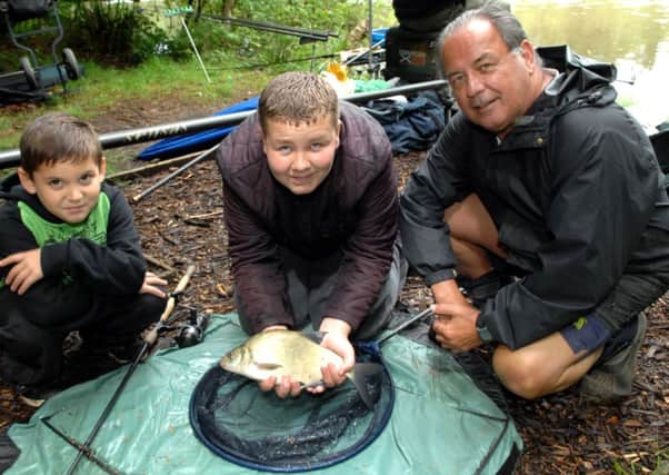 Crawley Angling teach in session at the New Pond June 2014 (Pic by Jon Rigby) SUS-140906-113518002