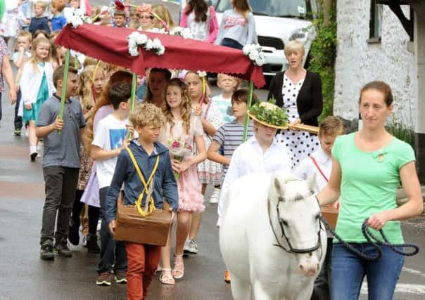 WH 070614 Children parade through Findon as part of this year's Summer Revels event