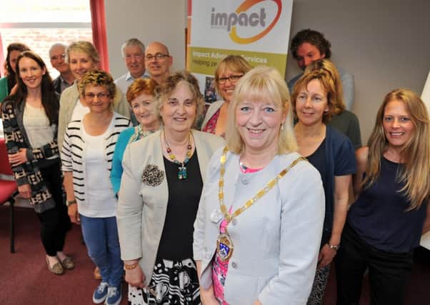 Littlehampton mayor Jill Long, centre, with volunteer Valerie Narayanaswamy and other advocates with Impact Initiative    D14221271a