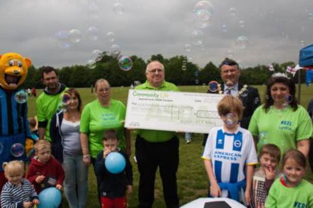 WKDS was presented a cheque for £200 by ASDA following its competition win SUS-141006-102501001