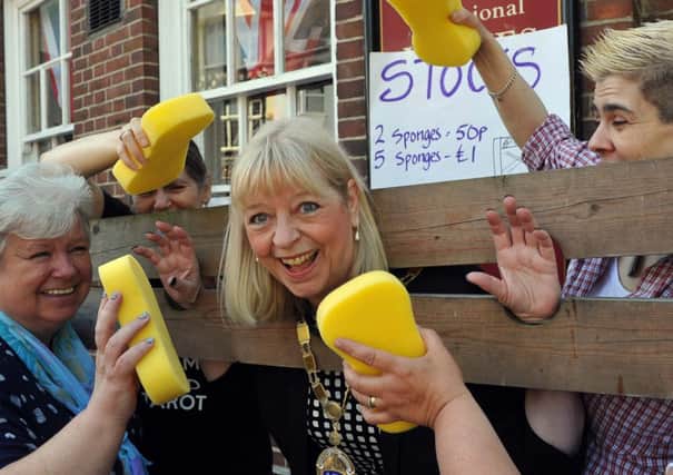 Splat  Littlehampton mayor Jill Long in the stocks for the charity fun day