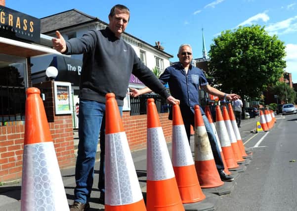 Mark Dyer (left) has seen a significant drop in business since part of South Road closed