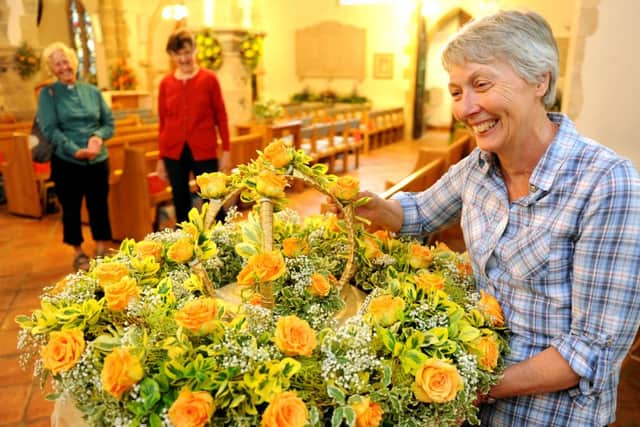 WH 070614  Barbara Stibbs with a floral arrangement