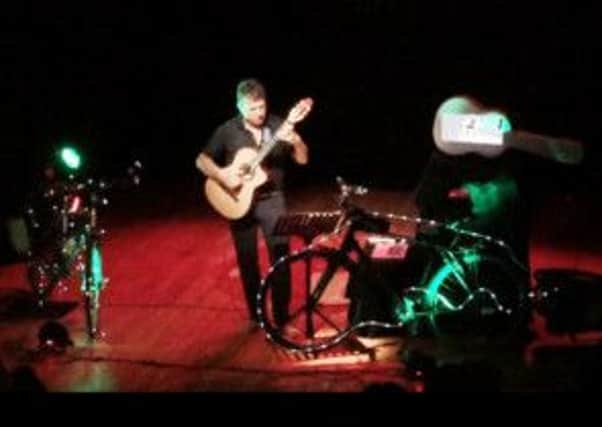 Guitarist Richard Durrant live on stage during his Cycling Music tour