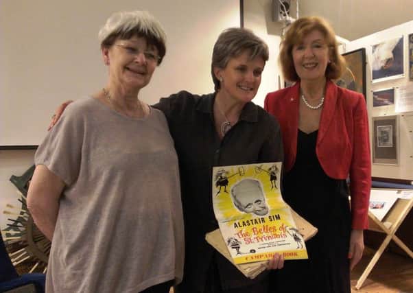 From left, Polly Baber, Lisa Holloway and Annabelle Heath with the original campaign book and script