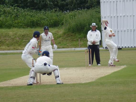 Elliot Hooper bowling for Hastings Priory against Horsham. Picture by Simon Newstead (SUS-140615-184152002)