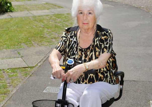 JPCT 130614 S14250169x Storrington. Iris Williams,85, uses a motorised scooter but Compus Buses won't take it on board -photo by Steve Cobb SUS-140613-164417001