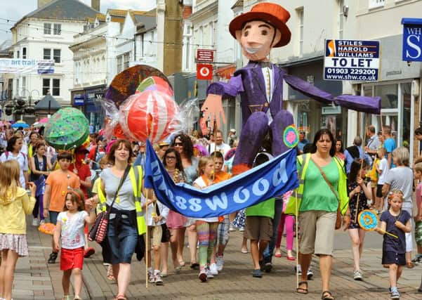 WH 140614 Worthing Children's Parade makes its way along Montague Street