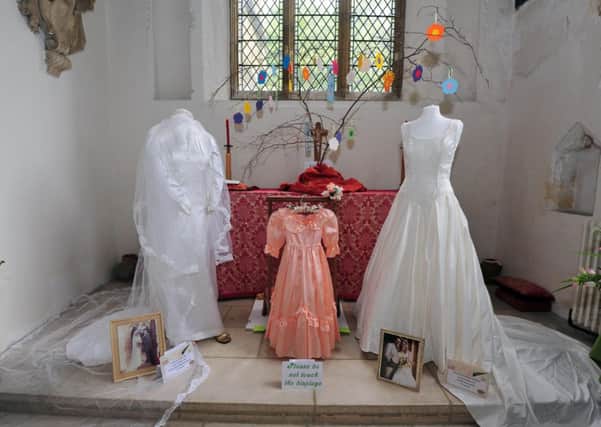 14/6/14- Wedding Dress and Flower Festival at St Mary's Church, Battle. SUS-140614-181307001