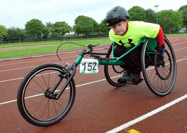 W21704H14   Nathan Freeman, ten, said the racing wheelchairs made him feel more independent