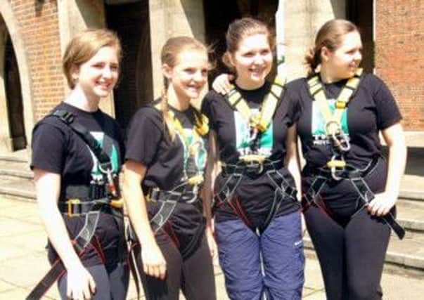 Former pupils of Ewhurst CofE Primary School get ready to abseil down Guilding Cathedral - picture submitted