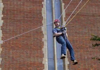 Ewhurst rector Rev David Minns abseiling down Guildford Cathedral - picture submitted