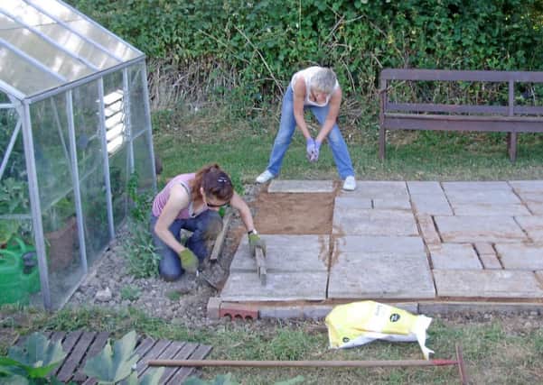 Horsham Community Allotment committee members Helen and Sarah laying patio as part of the Rudrisge Community Campaign - picture submitted