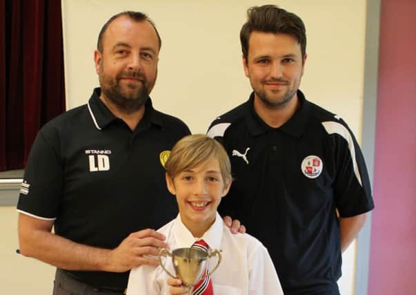Luke Derrick of Cuckfield Cosmos Utd with his Under 10B Golden Boot award with total of 30 goals (Sam Dowling Crawley Town FC right). picture supplied by DE Photo