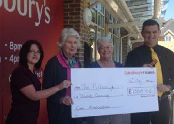 Sainsbury Staff, Jean Seagrim and Ann Kaiser - Community Care and Jason, Store Manager, Jason Howell. SUS-140623-160035001
