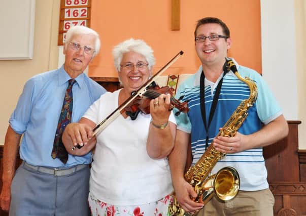 Musicians David Sayers, Linda Clark and Chris Clark raised funds for St. Barnabas at the Free Church on Saturday morning. Pic by Mike Beardall, Oakfield Media SUS-140623-164538001
