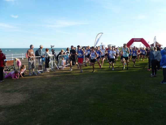 Runners set off in the second Bexhill 5K Seafront Series race yesterday evening. Picture by Simon Newstead (SUS-140626-131128002)
