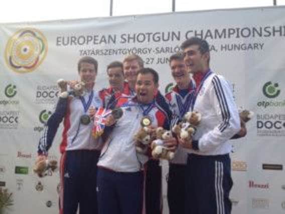 Steve Scott (centre) is all smiles after winning gold at the European Shotgun Championships in Hungary