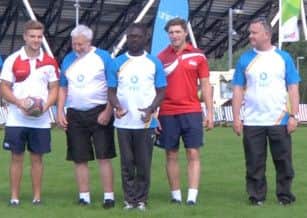 Tom Mitchell (third from left) with England teammate Phil Burgess and the baton bearers of the Queen's Baton Relay.