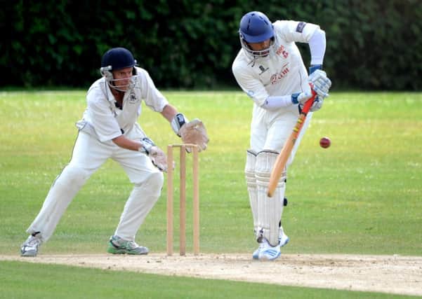 St Andrews (fielding) v Rams I. Wicket keeper Paul Brindle and batsman Hashil Patel. Pic Steve Robards SUS-140630-112156001
