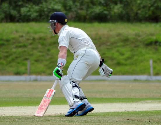 Leo Cammish takes a run for Hastings Priory against Eastbourne last weekend. Picture by Steve Hunnisett (SUS-140628-175223002)