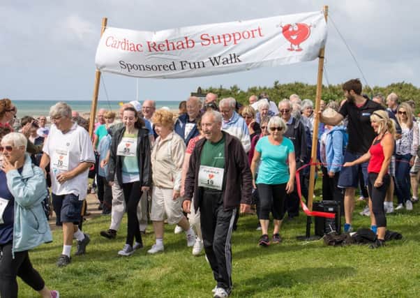 More than 100 people took part in the sponsored walk Picture by Peter R Hawkes