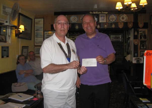 Horsham Lions Club present a cheque for £5000 to The Lions Clubs District of Kent Surrey & Sussex who are dealing with this Night Flying Appeal SUS-140407-120335001