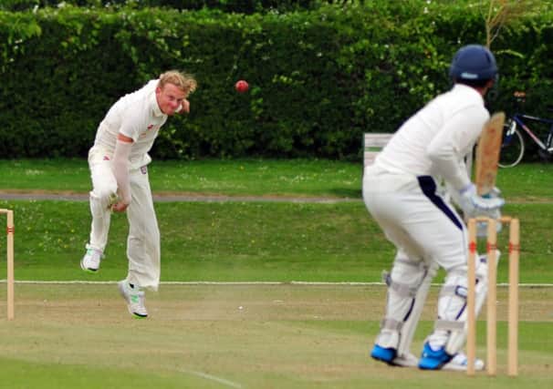 Dean Crawford bowling for Bexhill in their six-wicket victory at home to Hastings Priory. Picture by Steve Hunnisett (SUS-140507-173447002)