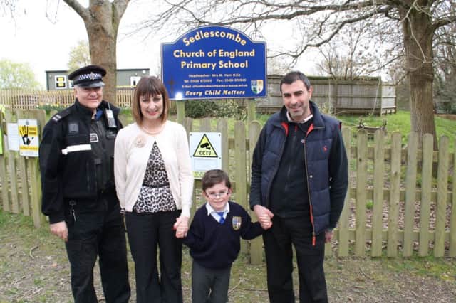 PCSO Demi Georghiou, Mrs Ham (Sedlescombe CE Primary School Headteacher), Christian Fortunato, Max Fortunato (Christian's father).

The image provided remains the property of Sussex Police. SUS-140907-125720001
