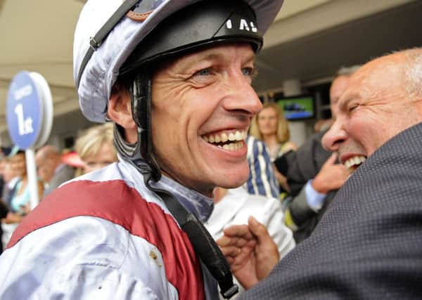 Richard Hughes celebrates after winning the 2013 Sussex Stakes on Toronado  Picture by Malcolm Wells